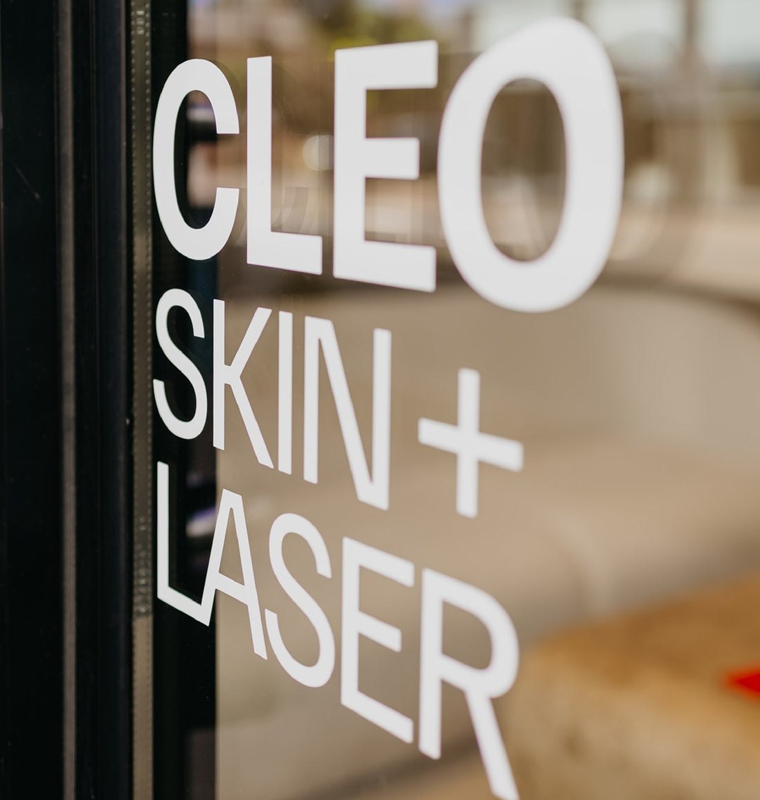 Cleo Skin + Laser branding on front door