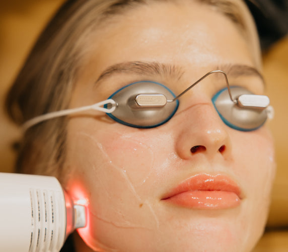 Woman receiving contour facial treatment