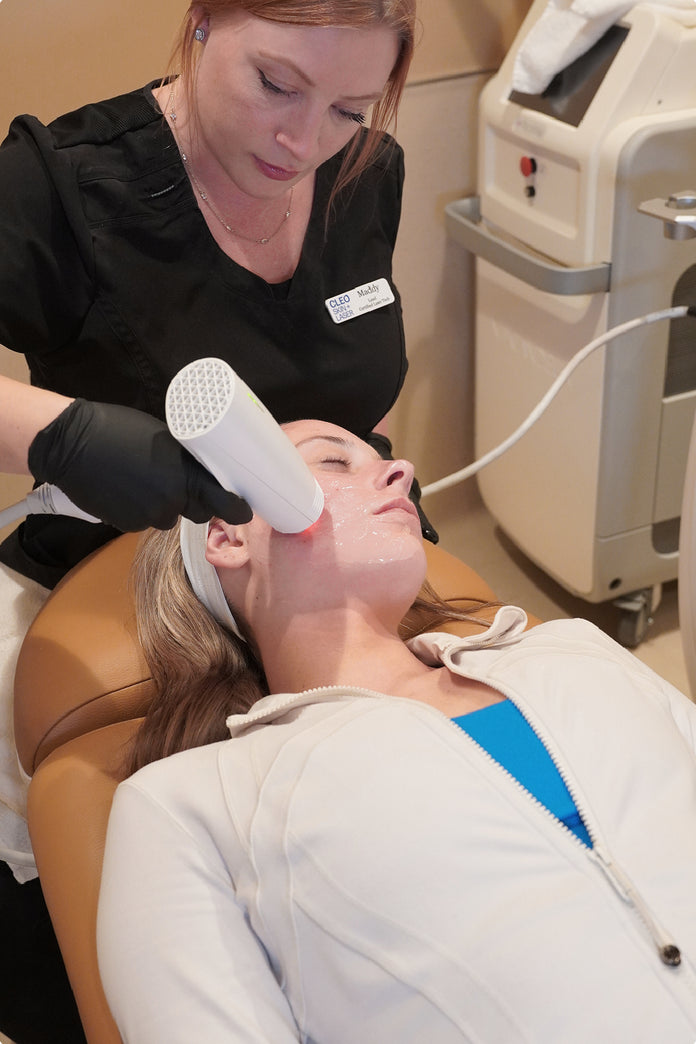 Woman receiving a facial treatment