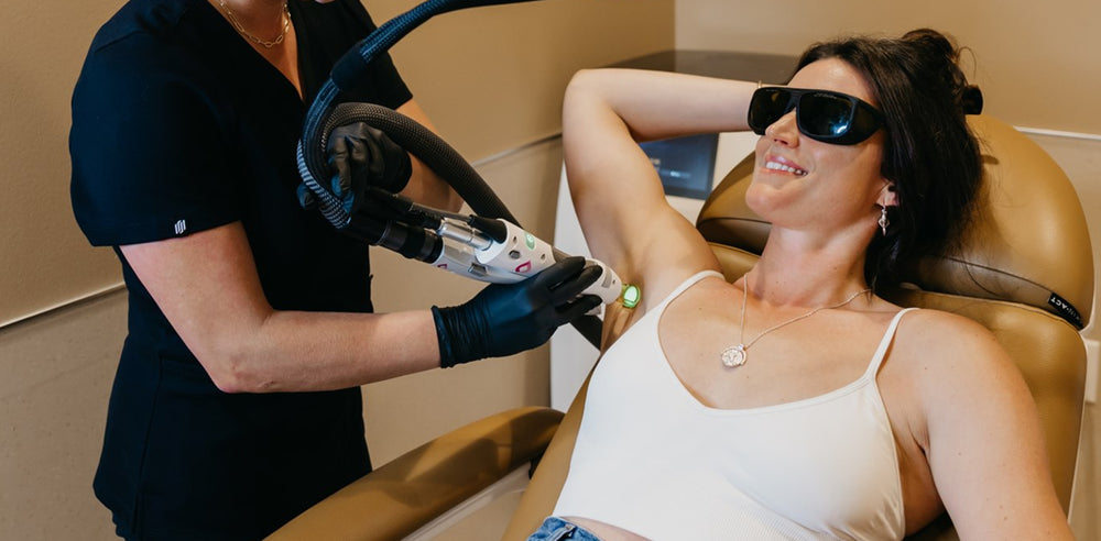 Candela GentleMax Pro Plus procedure being performed on woman lying back in treatment chair