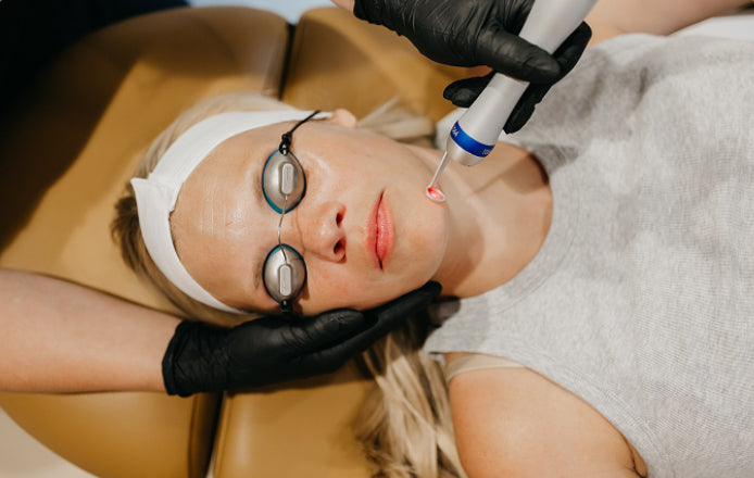 Person receiving The Skin Shield Pico Laser with goggles on their eyes.