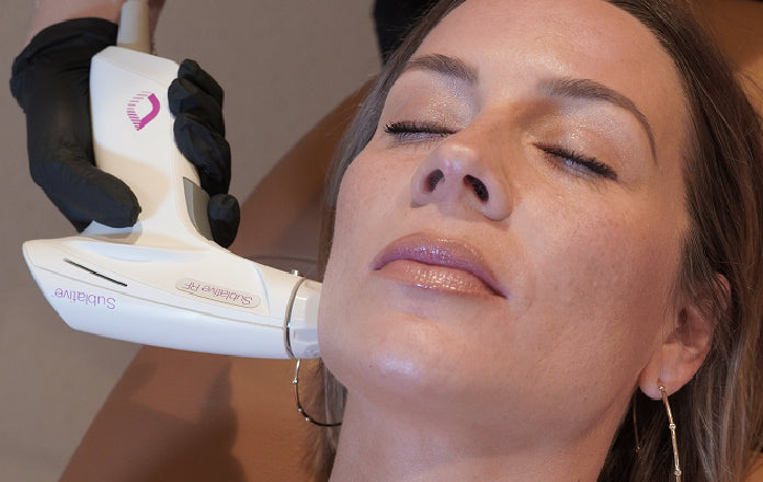 Woman receiving sublative facial treatment