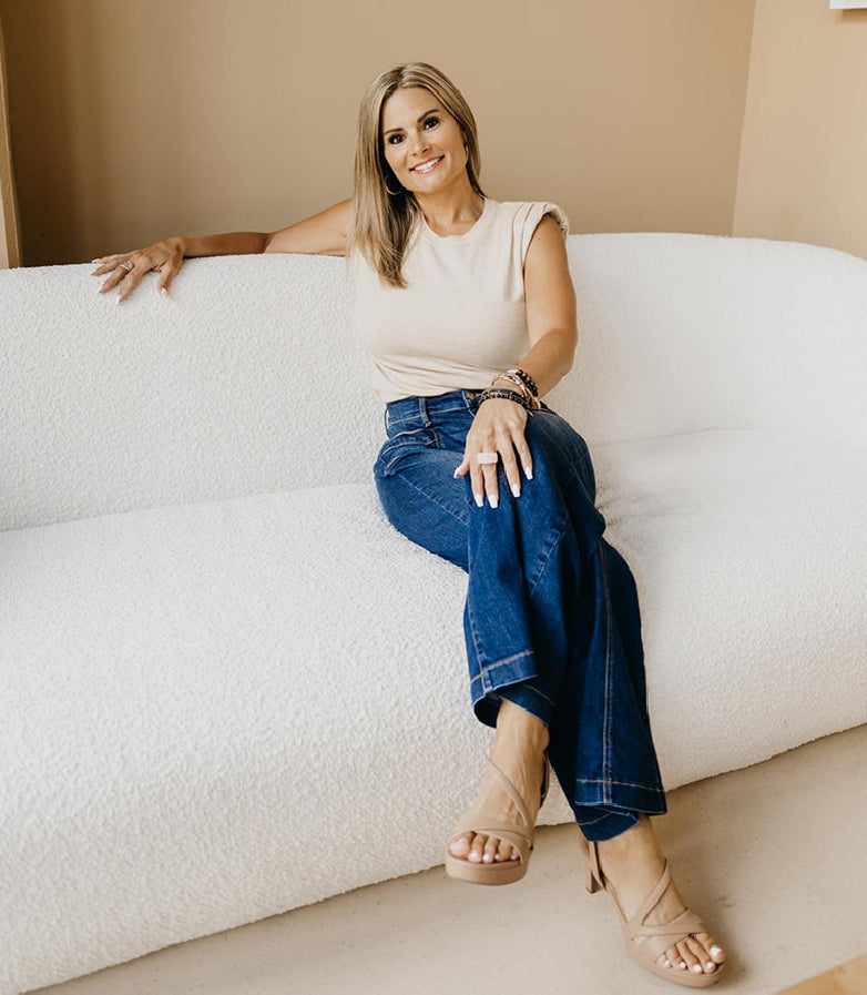 Woman sitting casually on couch